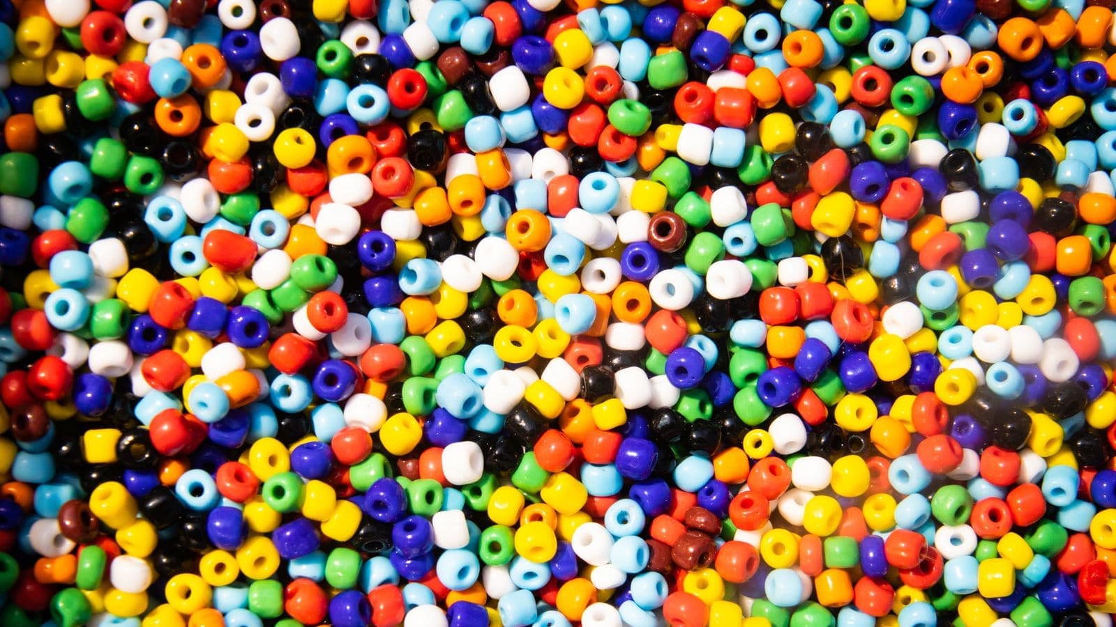 A close-up of colourful craft beads