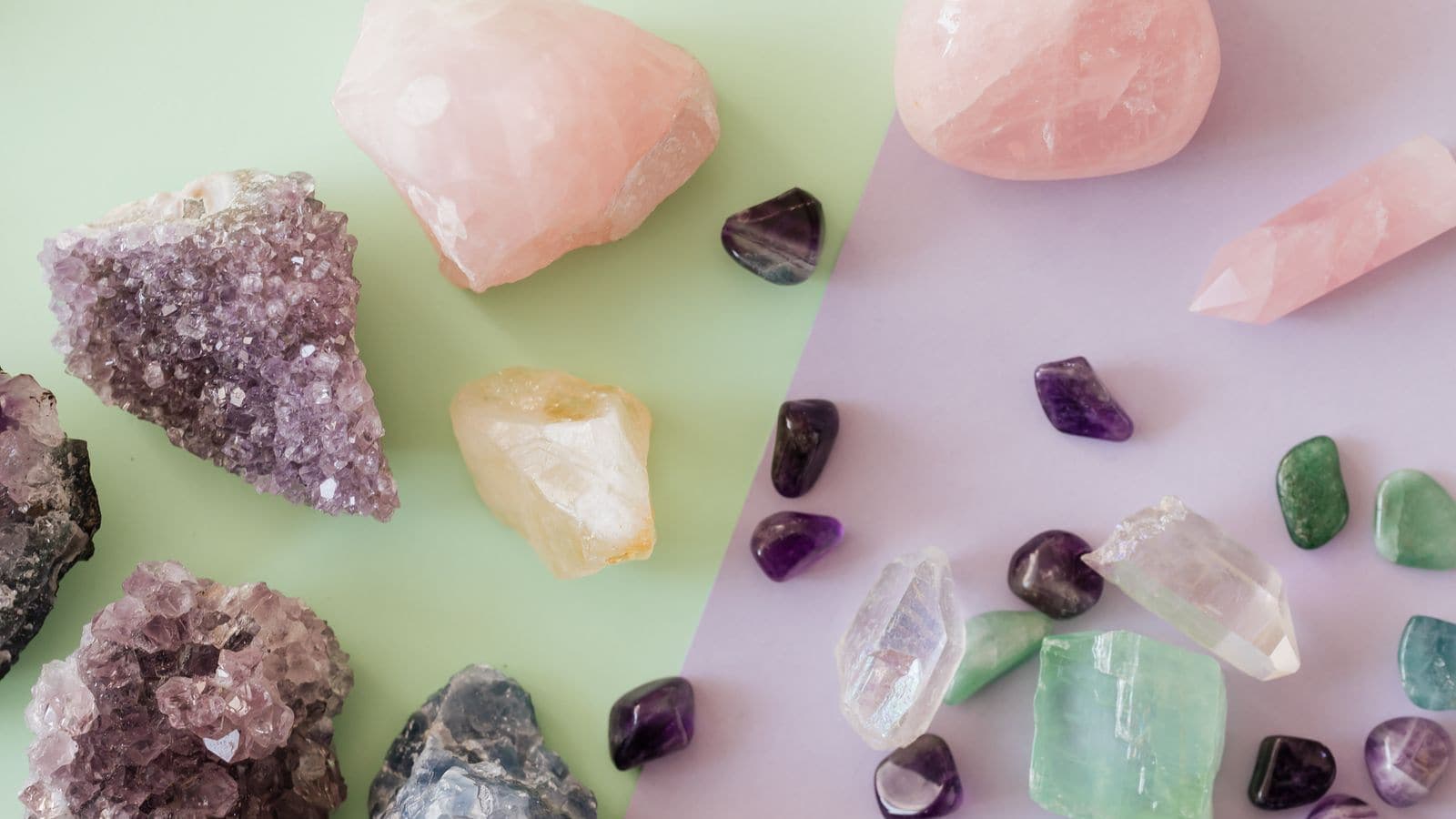Polished amethyst, quartz and other crystals on a pastel background